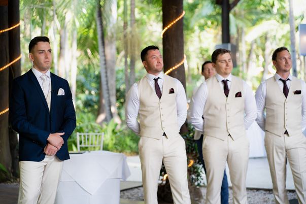 A groom is emotional and cries when he sees his bride walking down the aisle at Cedar Creek Lodges in Tamborine Mountain