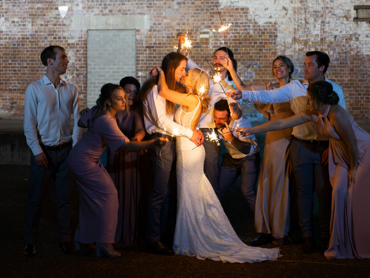 Fun sparkler Wedding photo at the Brisbane powerhouse. Bride wearing a When Freddie met Lilly wedding dress