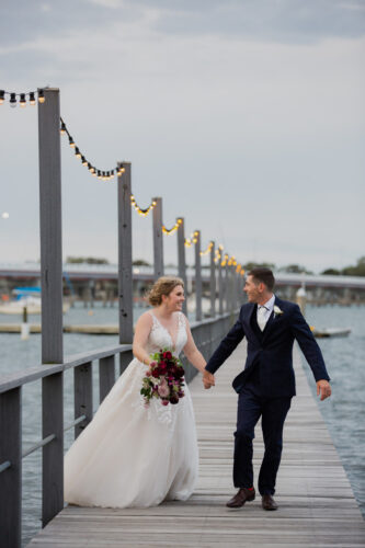 Bride and Groom Dance on the pier at Sandstone Point Hotel Wedding